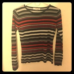 A long sleeved striped sweater.
